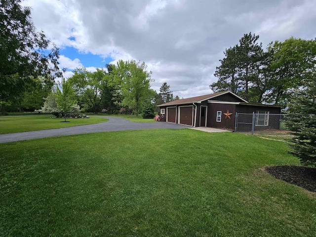 9388 Alpine Rd, Fremont, WI 54940 - view of yard featuring driveway, an outbuilding, and a garage