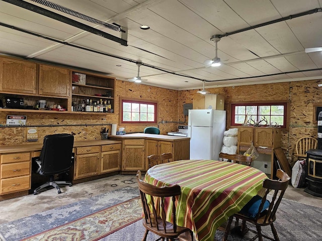 9388 Alpine Rd, Fremont, WI 54940 - dining space with unfinished concrete floors and a desk