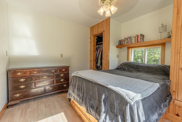 17785 Circle Dr, Boscobel, WI 53805 - bedroom with light wood-style flooring, vaulted ceiling, and a ceiling fan