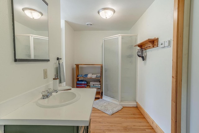 17785 Circle Dr, Boscobel, WI 53805 - full bath with a stall shower, wood finished floors, and vanity