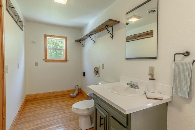 17785 Circle Dr, Boscobel, WI 53805 - bathroom featuring wood finished floors, toilet, vanity, and baseboards