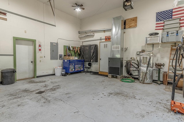 17785 Circle Dr, Boscobel, WI 53805 - garage featuring electric panel, a garage door opener, and an AC wall unit