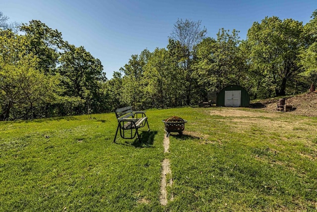 17785 Circle Dr, Boscobel, WI 53805 - view of grassy yard with an outdoor fire pit