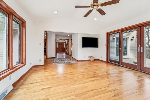 79 Oakridge Ct, Fond Du Lac, WI 54937 - unfurnished living room with plenty of natural light, vaulted ceiling, light wood-style flooring, a ceiling fan, and recessed lighting