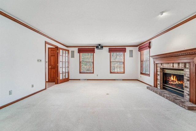 79 Oakridge Ct, Fond Du Lac, WI 54937 - unfurnished living room featuring a brick fireplace, crown molding, carpet floors, baseboards, and healthy amount of natural light