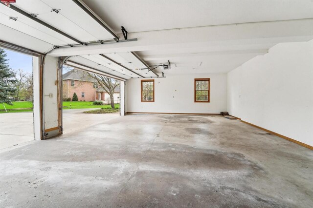 79 Oakridge Ct, Fond Du Lac, WI 54937 - garage with baseboards and a garage door opener