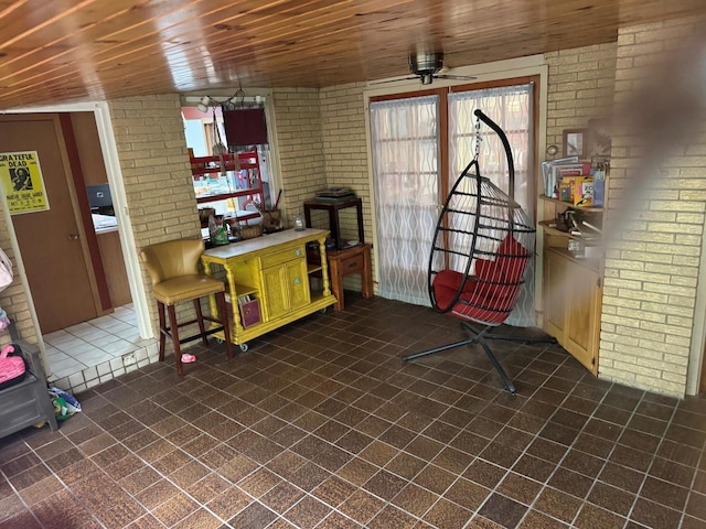 1306 Grandview Ave, Oconomowoc, WI 53066 - living area with brick wall, ceiling fan, and wood ceiling