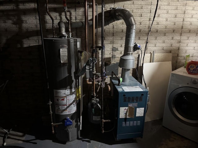 1306 Grandview Ave, Oconomowoc, WI 53066 - utilities with washer / clothes dryer, gas water heater, and a heating unit
