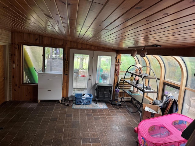 1306 Grandview Ave, Oconomowoc, WI 53066 - sunroom featuring a wood stove, lofted ceiling, and a baseboard heating unit