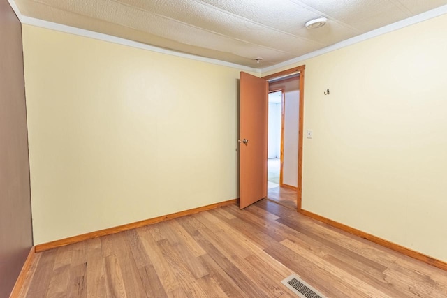 W3703 Scotch Coulee Rd, West Salem, WI 54669 - empty room featuring light wood-style floors, ornamental molding, and baseboards