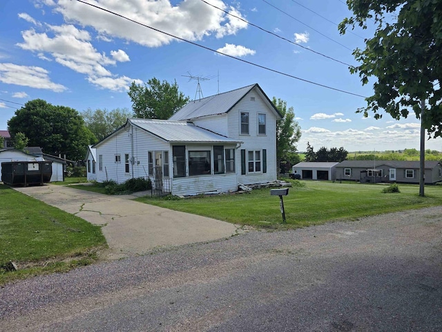4027 Creamery St, Stitzer, WI 53825 - traditional home featuring a front yard and metal roof