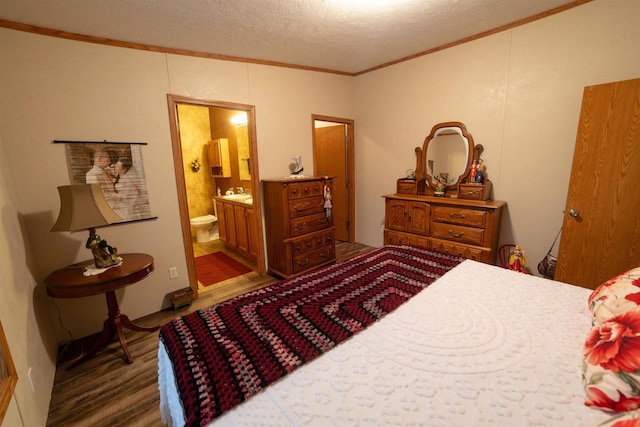 W7744 County Rd E, Westfield, WI 53964 - bedroom with ornamental molding, wood finished floors, a textured ceiling, and ensuite bathroom