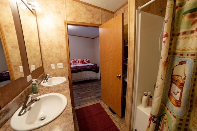 W7744 County Rd E, Westfield, WI 53964 - ensuite bathroom with crown molding, double vanity, and shower / tub combo with curtain
