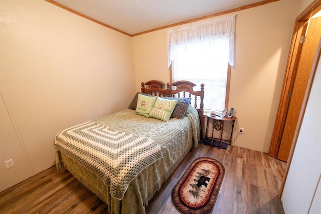 W7744 County Rd E, Westfield, WI 53964 - bedroom featuring wood finished floors and ornamental molding