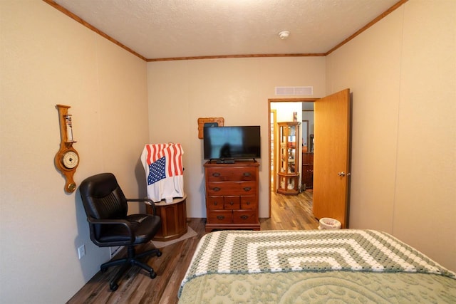 W7744 County Rd E, Westfield, WI 53964 - bedroom with crown molding, wood finished floors, and a textured ceiling