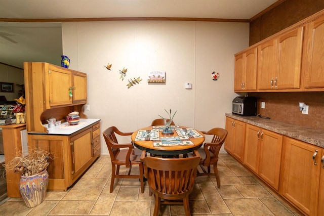 W7744 County Rd E, Westfield, WI 53964 - dining space featuring crown molding and light tile patterned floors