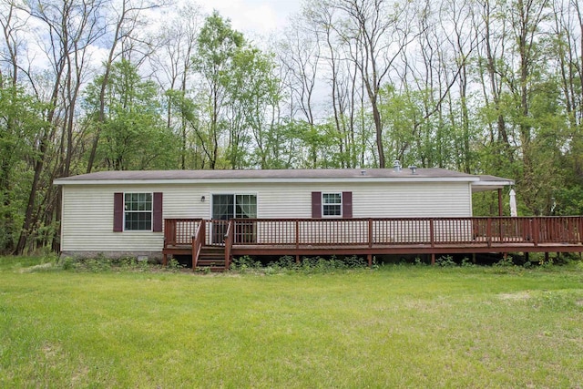 W7744 County Rd E, Westfield, WI 53964 - back of property with a wooden deck, a yard, and crawl space