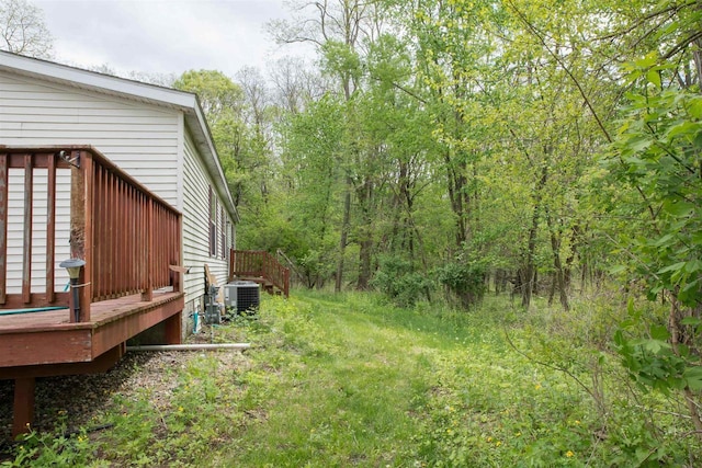 W7744 County Rd E, Westfield, WI 53964 - view of yard featuring a deck and central AC unit