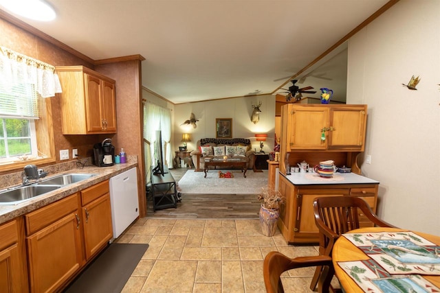 W7744 County Rd E, Westfield, WI 53964 - kitchen featuring dishwasher, a sink, ceiling fan, open floor plan, and brown cabinetry