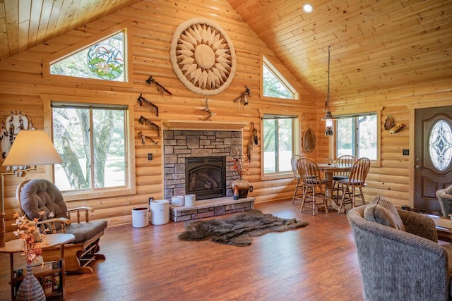 N12124 12th Ave, Necedah, WI 54646 - living room with high vaulted ceiling, log walls, wooden ceiling, healthy amount of natural light, and a fireplace