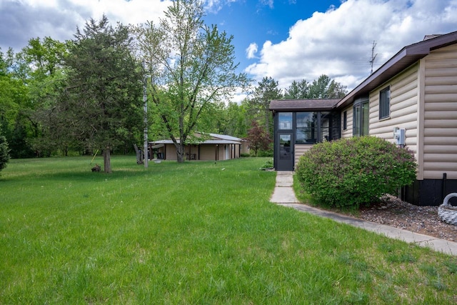 N12124 12th Ave, Necedah, WI 54646 - view of green lawn with a sunroom