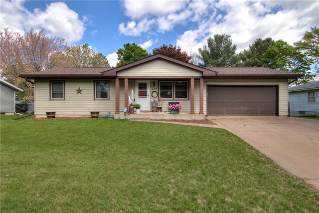 739 Veronica St, Chippewa Falls, WI 54729 - ranch-style home featuring a porch, an attached garage, concrete driveway, and a front yard