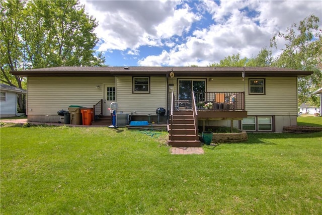 739 Veronica St, Chippewa Falls, WI 54729 - back of property with a deck, a yard, and stairs