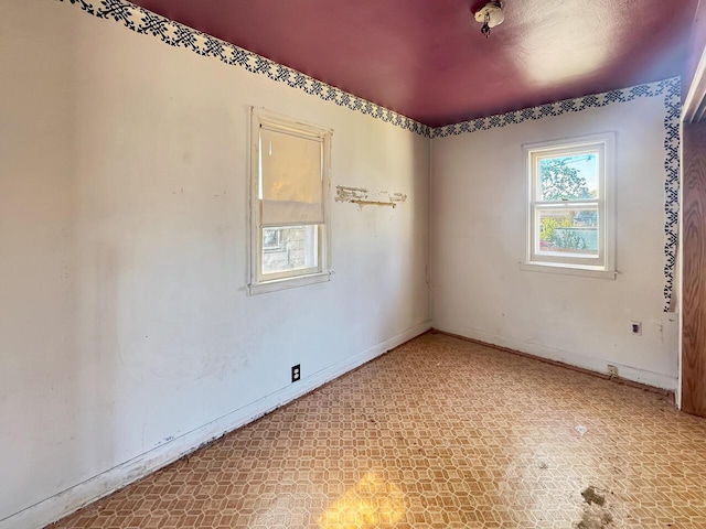 6913 W Main St, Milwaukee, WI 53214 - spare room featuring baseboards