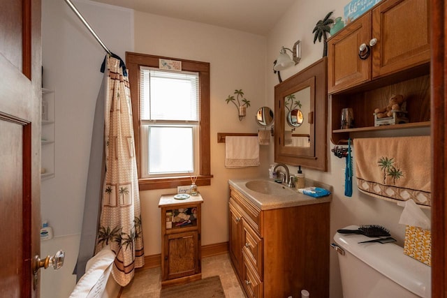 1427 Madison Ave, South Milwaukee, WI 53172 - full bathroom with vanity, toilet, shower / bathtub combination with curtain, and tile patterned flooring