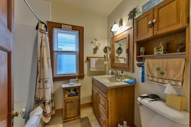 1427 Madison Ave, South Milwaukee, WI 53172 - full bathroom with toilet, vanity, tile patterned floors, shower / bathtub combination with curtain, and baseboards