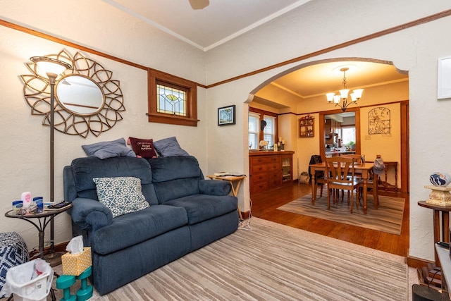 1427 Madison Ave, South Milwaukee, WI 53172 - living room with wood finished floors, arched walkways, a chandelier, and ornamental molding