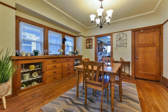 1427 Madison Ave, South Milwaukee, WI 53172 - dining room with wood finished floors, a chandelier, and ornamental molding