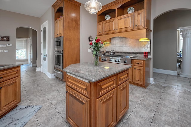 18290 Prairie Falcon Ln, Brookfield, WI 53045 - kitchen with arched walkways, open shelves, appliances with stainless steel finishes, and a warming drawer