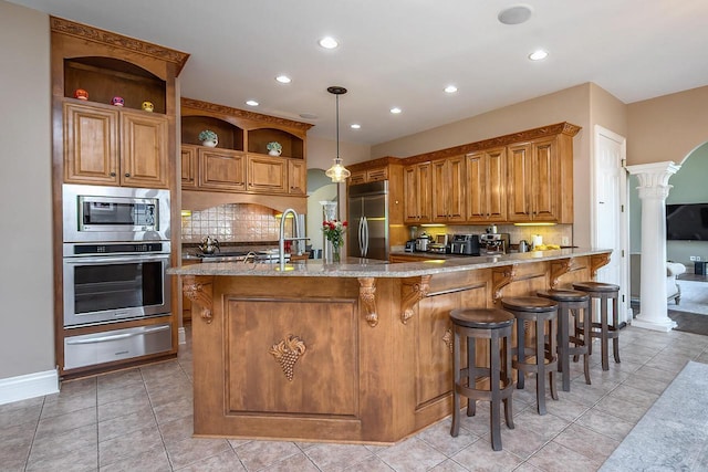 18290 Prairie Falcon Ln, Brookfield, WI 53045 - kitchen with built in appliances, a warming drawer, open shelves, decorative columns, and decorative backsplash