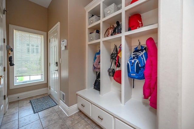 18290 Prairie Falcon Ln, Brookfield, WI 53045 - mudroom with light tile patterned flooring and baseboards