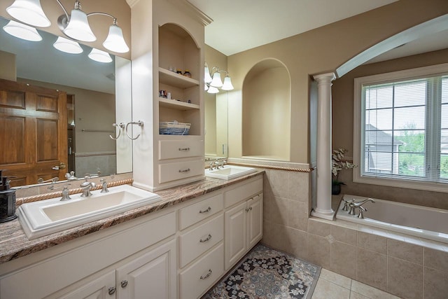 18290 Prairie Falcon Ln, Brookfield, WI 53045 - bathroom featuring double vanity, ornate columns, tile patterned flooring, and tiled tub