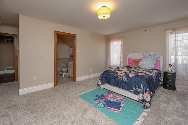 18290 Prairie Falcon Ln, Brookfield, WI 53045 - carpeted bedroom featuring multiple windows, baseboards, and connected bathroom