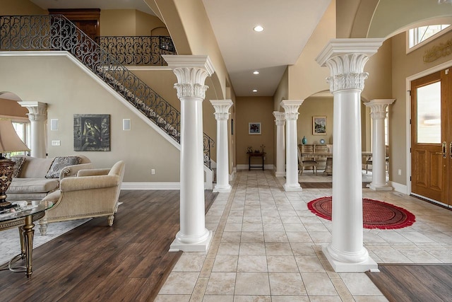 18290 Prairie Falcon Ln, Brookfield, WI 53045 - foyer with a towering ceiling, plenty of natural light, stairway, recessed lighting, and baseboards