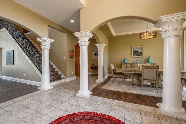 18290 Prairie Falcon Ln, Brookfield, WI 53045 - dining room featuring tile patterned flooring, recessed lighting, crown molding, baseboards, and stairway