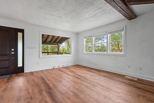 10104 Washington Ave, Mount Pleasant, WI 53177 - entrance foyer featuring wood finished floors, baseboards, and a textured ceiling