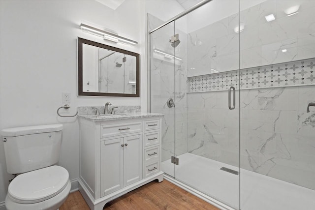 10104 Washington Ave, Mount Pleasant, WI 53177 - bathroom featuring toilet, wood finished floors, a marble finish shower, and vanity