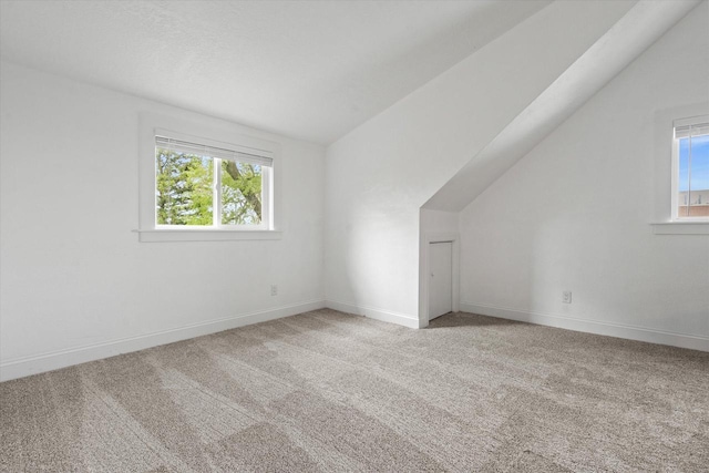 10104 Washington Ave, Mount Pleasant, WI 53177 - bonus room featuring lofted ceiling, healthy amount of natural light, carpet, and baseboards