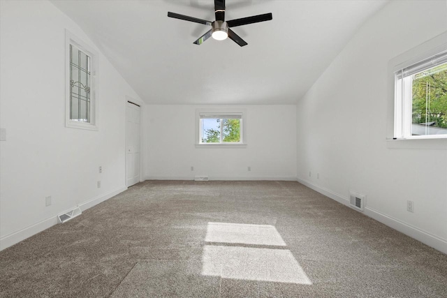10104 Washington Ave, Mount Pleasant, WI 53177 - carpeted empty room with lofted ceiling, plenty of natural light, a ceiling fan, and baseboards