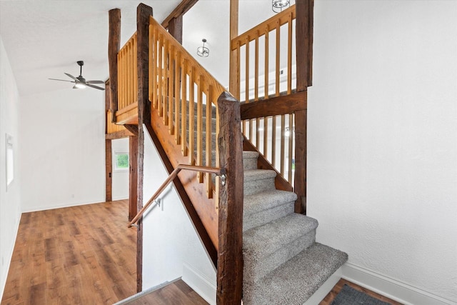 10104 Washington Ave, Mount Pleasant, WI 53177 - stairs featuring a ceiling fan, wood finished floors, and baseboards