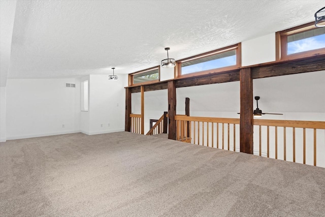 10104 Washington Ave, Mount Pleasant, WI 53177 - spare room with a textured ceiling, carpet floors, and a ceiling fan