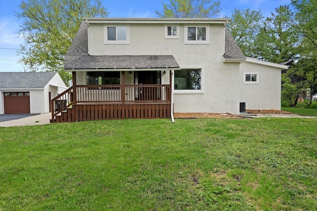 10104 Washington Ave, Mount Pleasant, WI 53177 - view of front facade featuring stucco siding, an outdoor structure, roof with shingles, and a front lawn