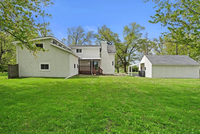 10104 Washington Ave, Mount Pleasant, WI 53177 - rear view of property with a yard and stucco siding