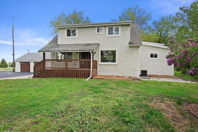 10104 Washington Ave, Mount Pleasant, WI 53177 - view of front of property featuring covered porch, stucco siding, a garage, a front yard, and roof with shingles