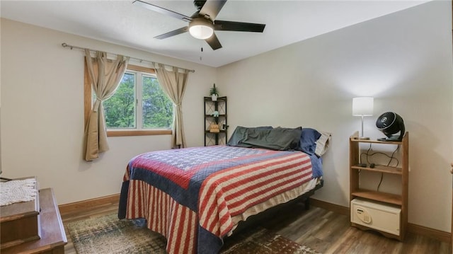 3015 Aspen Ter, Danbury, WI 54830 - bedroom with wood finished floors, baseboards, and a ceiling fan