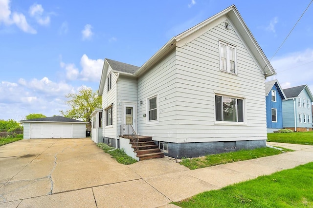 2301 W High St, Racine, WI 53404 - view of front of property featuring an outdoor structure and a detached garage